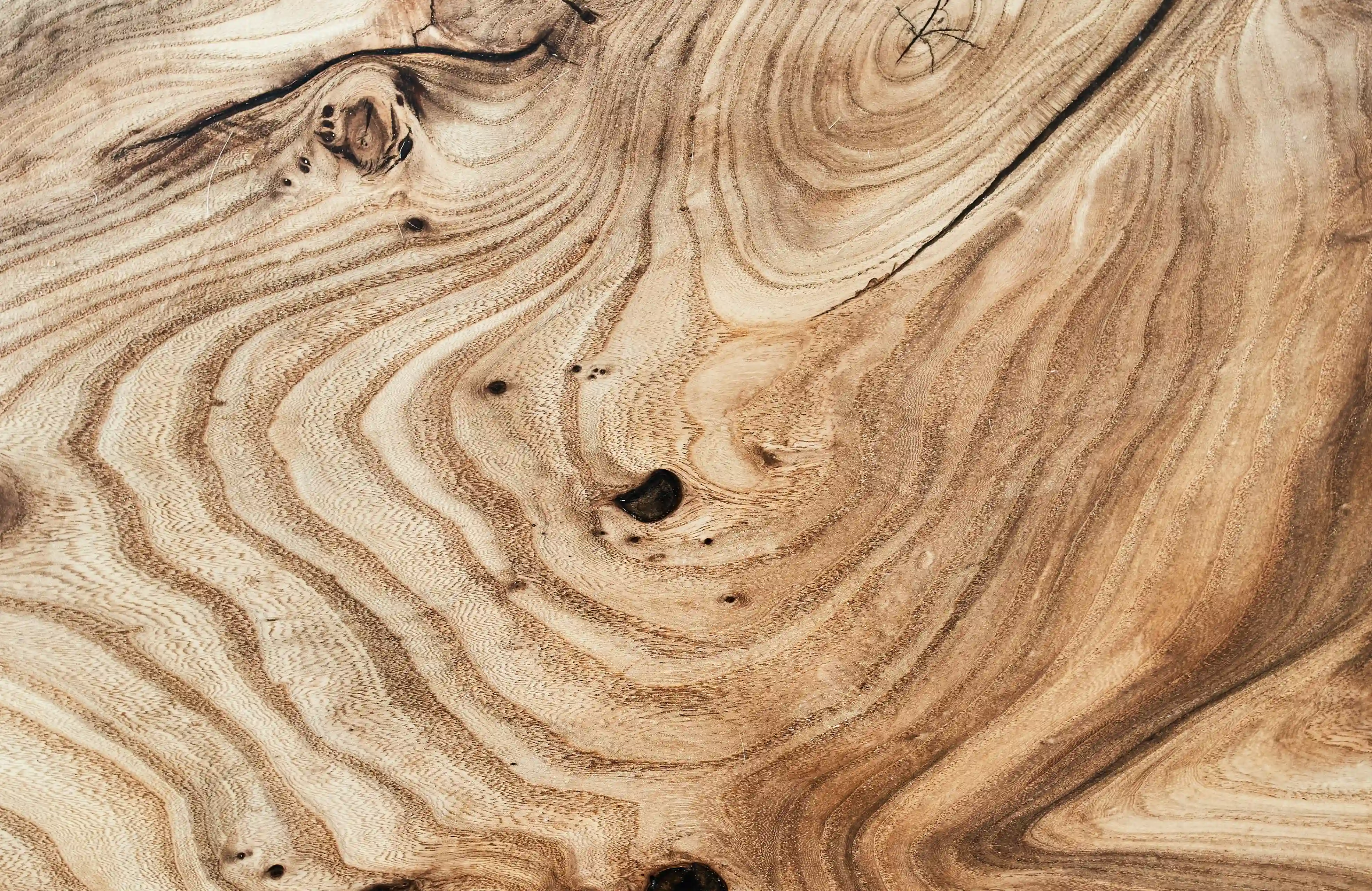 Wood selection process in our Jepara workshop, ensuring premium quality teak.